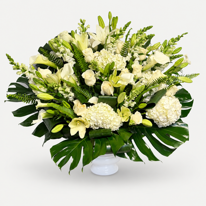 Eternal Grace white funeral flower arrangement in a white urn — Bella Rosa MTL, Montreal
